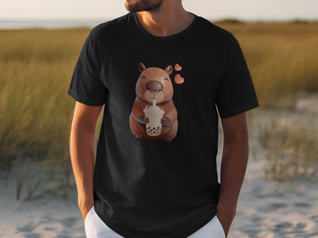 Black t-shirt with cartoon capybara drinking boba tea and pink hearts.