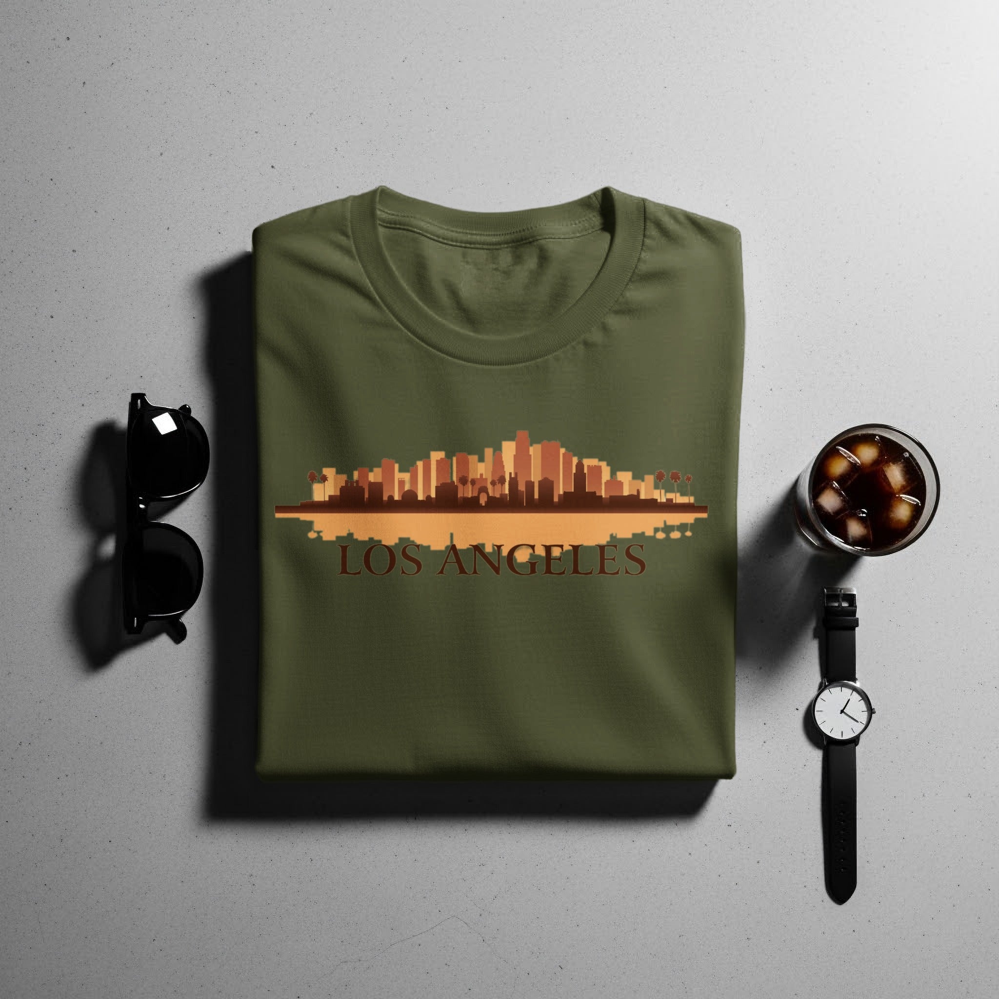 Olive green t-shirt with Los Angeles skyline graphic and text.
