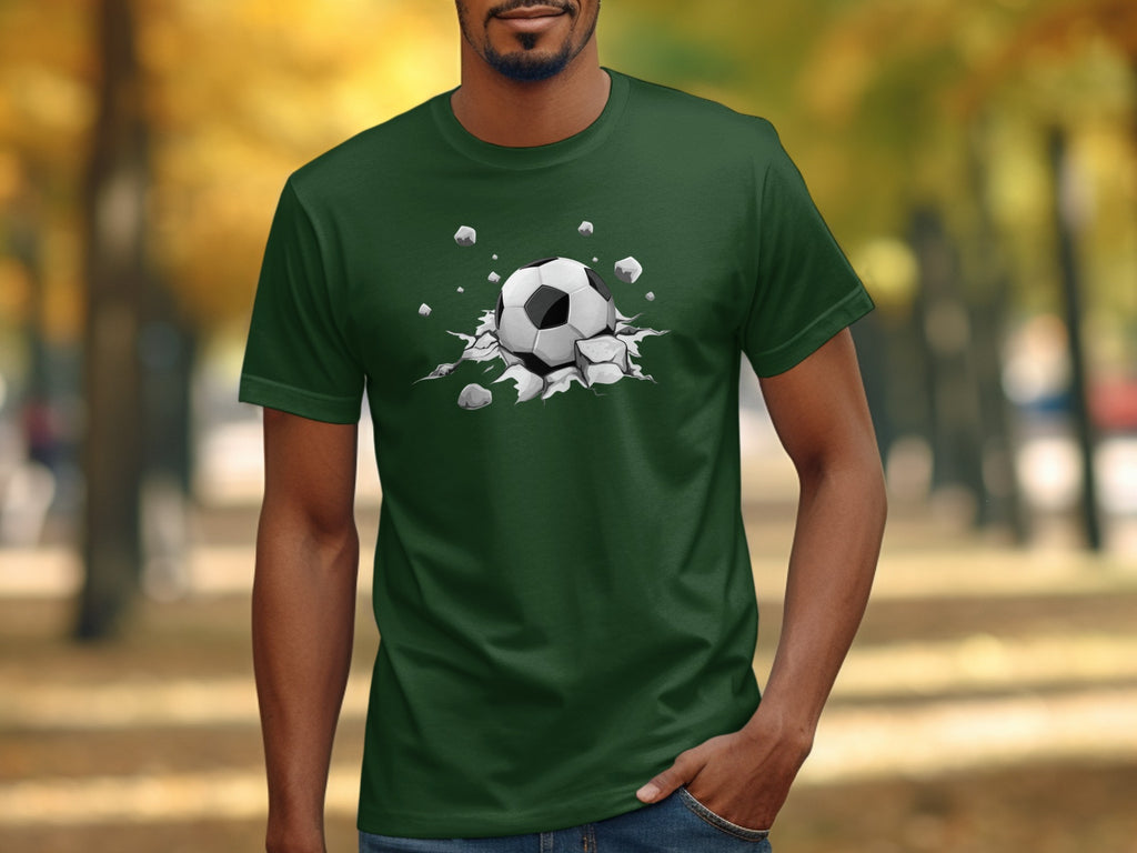 Green t-shirt with a soccer ball bursting through the fabric design