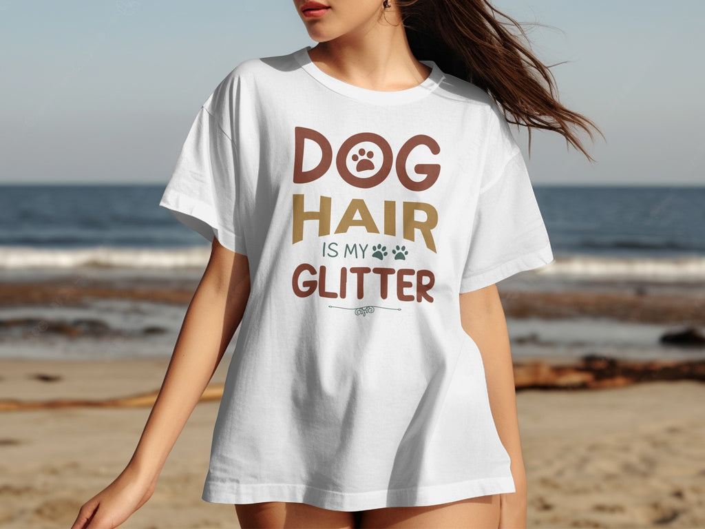 White t-shirt with "DOG HAIR IS MY GLITTER" text and paw prints.