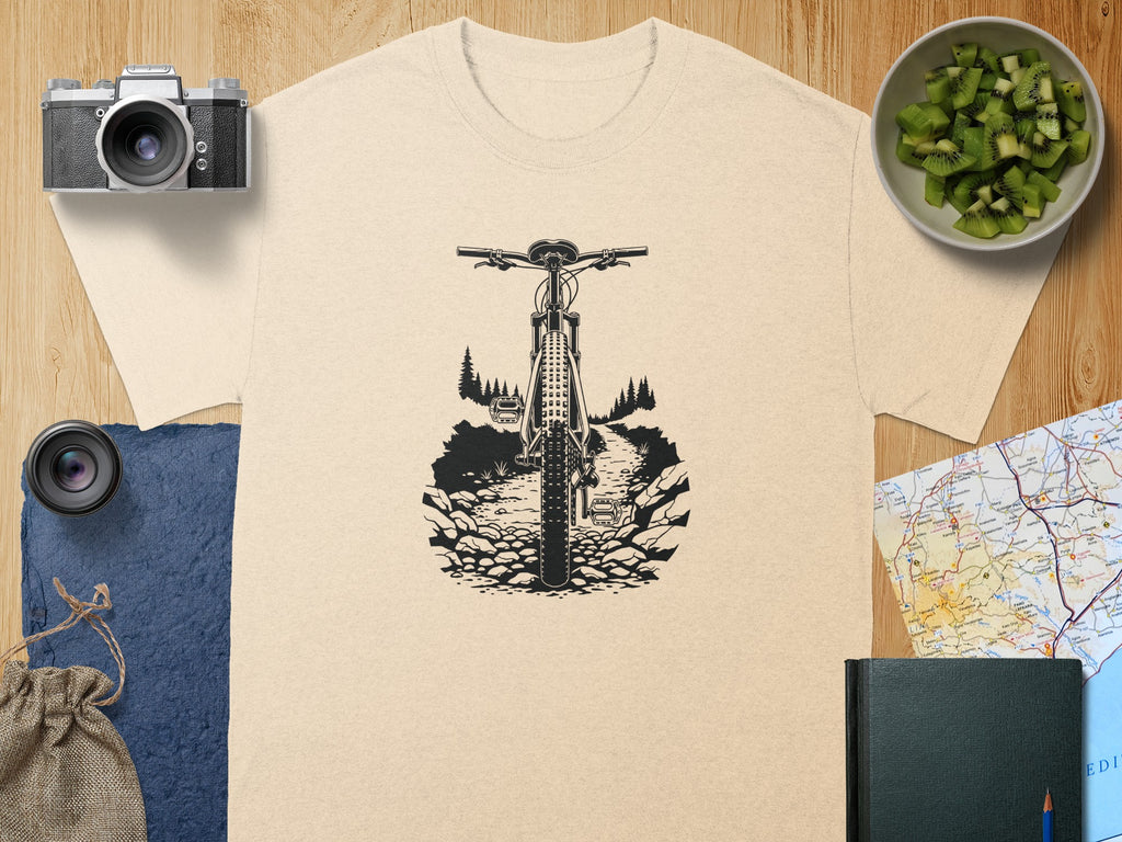 T-shirt with black graphic of mountain bike on a rocky trail.