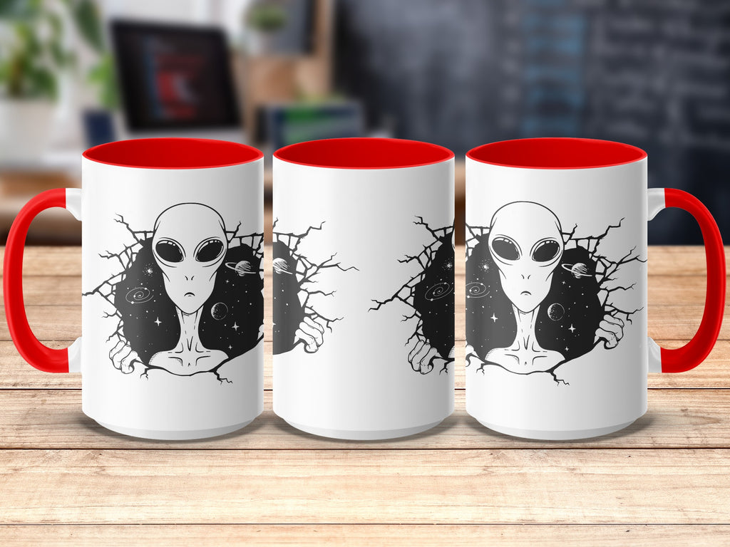 Three white mugs with red handles and interiors feature an alien design breaking through cracked space.