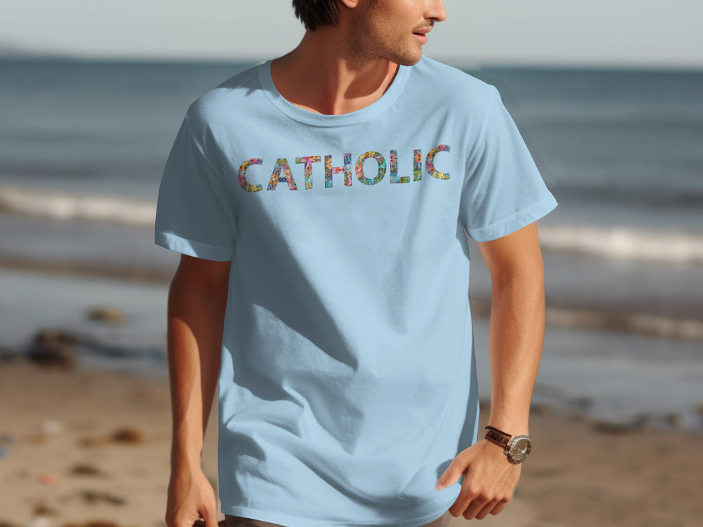 Light blue t-shirt with "CATHOLIC" text in colorful floral pattern.