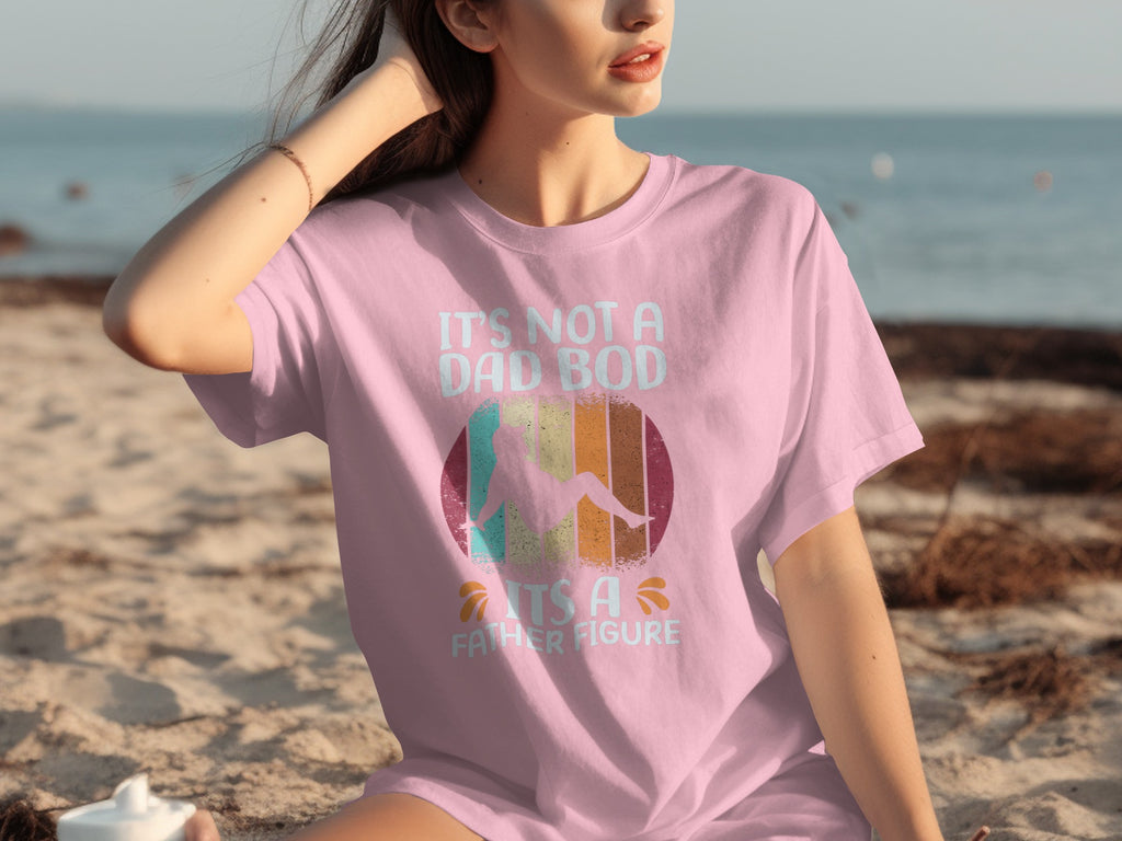 Pink t-shirt with "It's Not A Dad Bod, It's A Father Figure" text and graphic.
