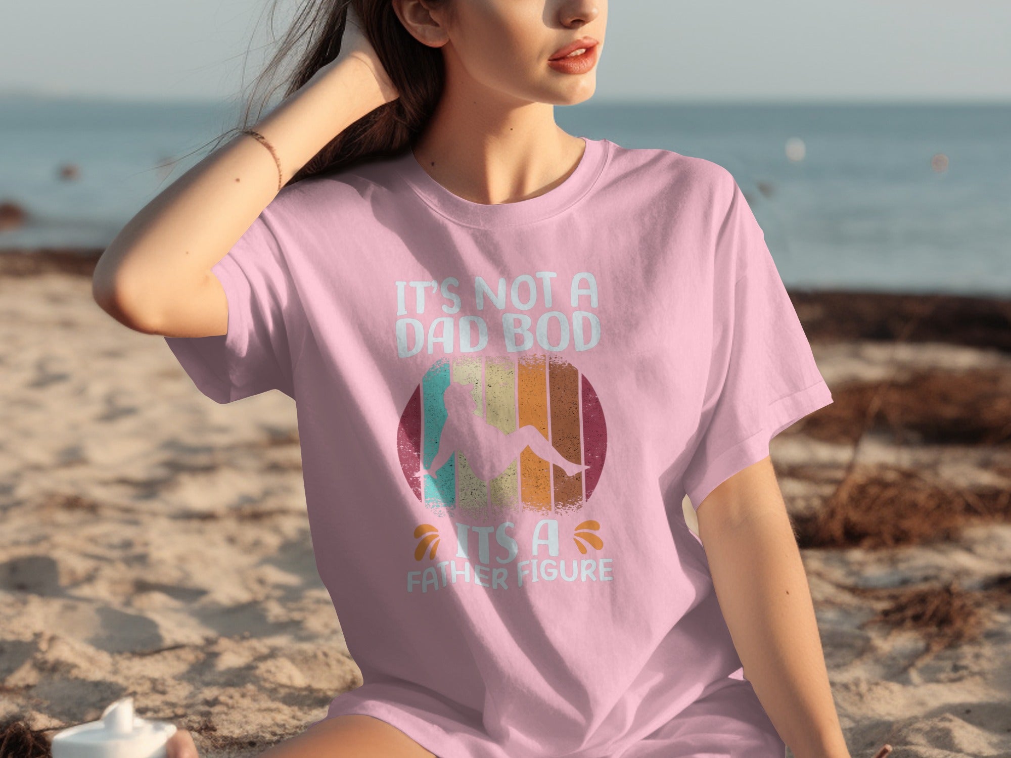 Pink t-shirt with "It's Not A Dad Bod, It's A Father Figure" text and graphic.