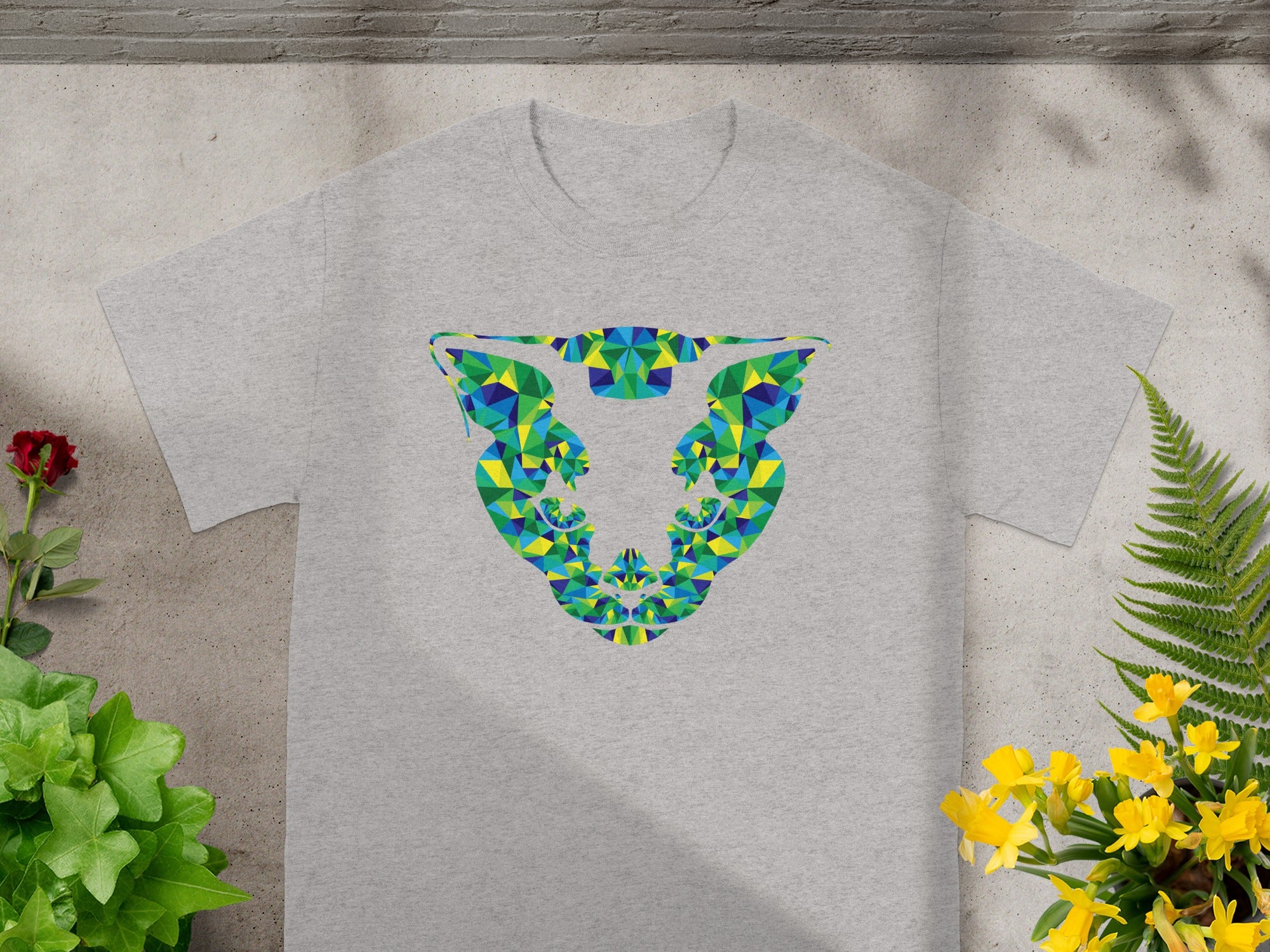 Grey t-shirt with a colorful geometric bull head design.