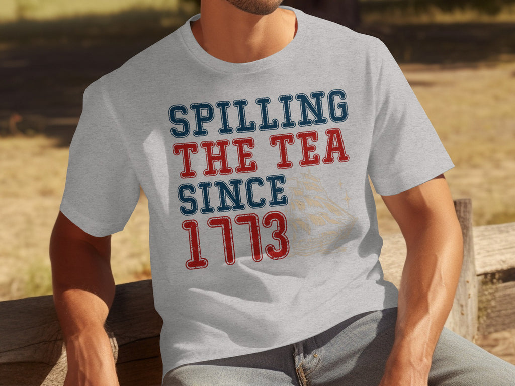 Light grey t-shirt with "Spilling The Tea Since 1773" text and ship graphic.