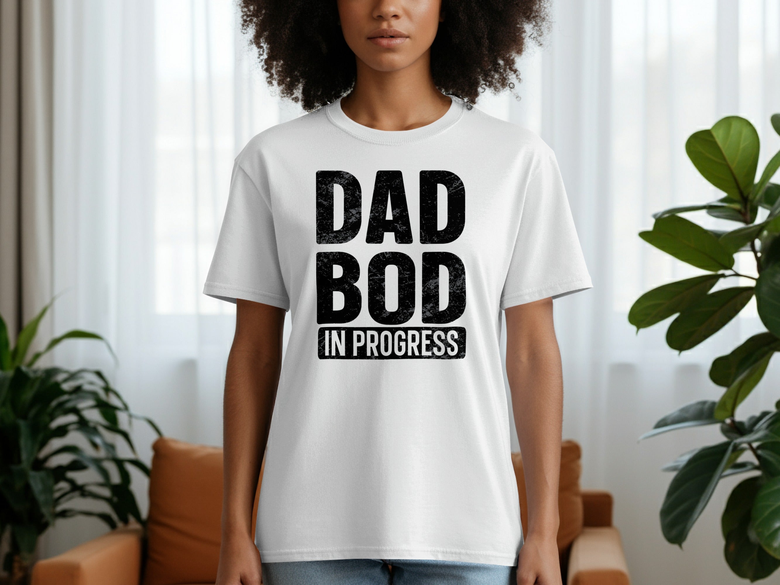 White t-shirt with black text "DAD BOD" and "IN PROGRESS".