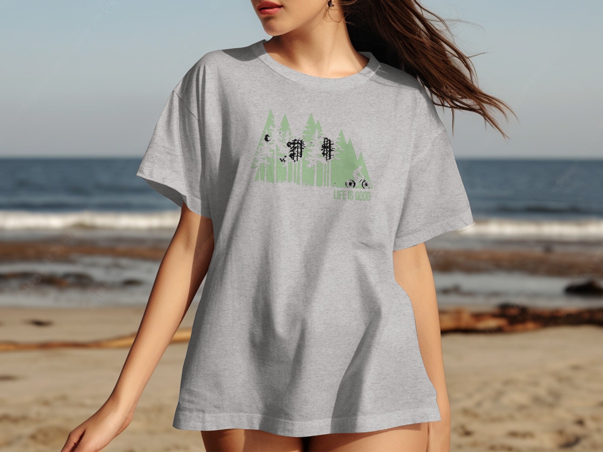 Grey t-shirt with forest and mountain graphic, cyclist, and "Life is Good" text.