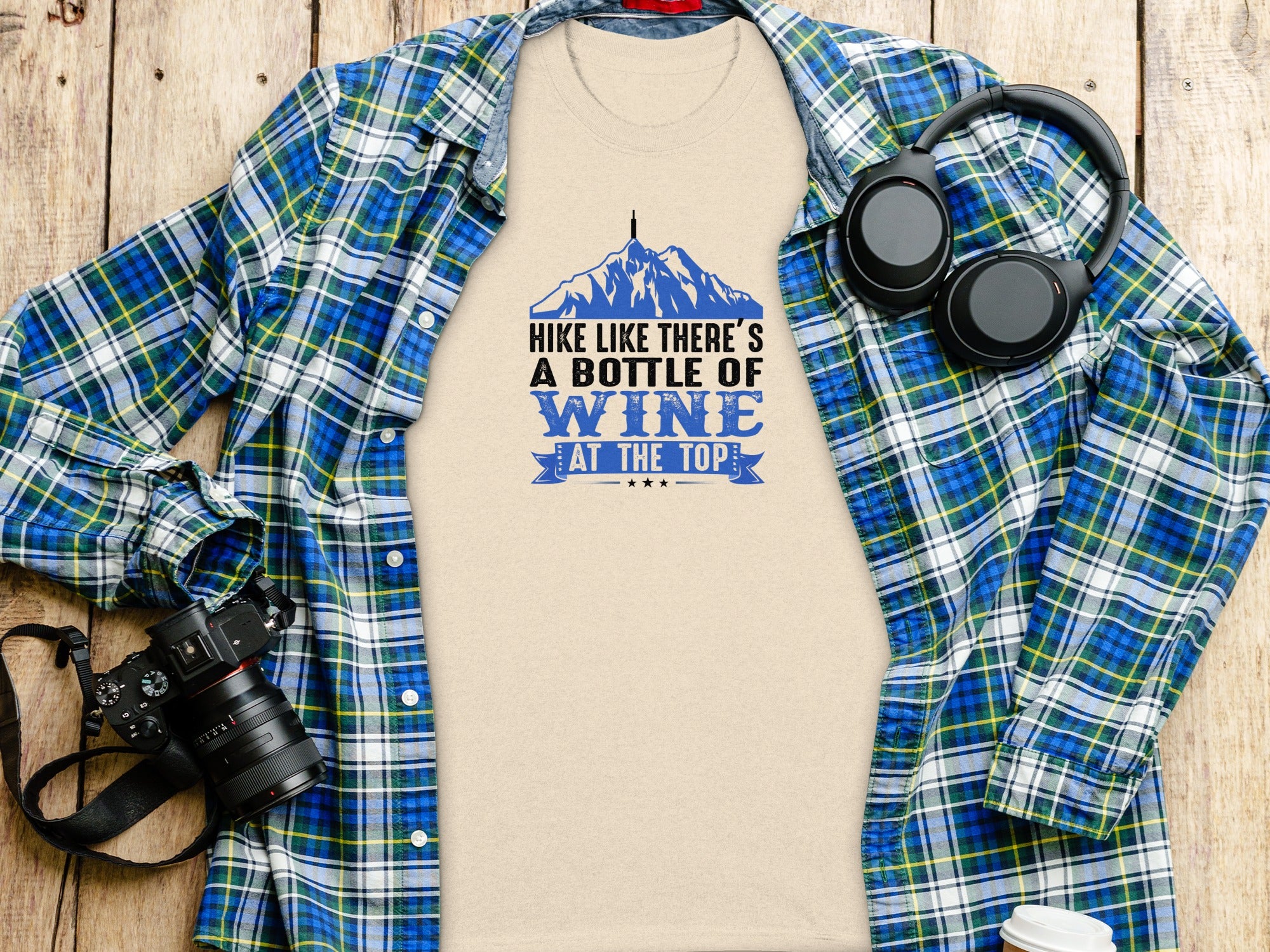 Beige t-shirt with "Hike Like There's a Bottle of Wine at the Top" text and mountain graphic.