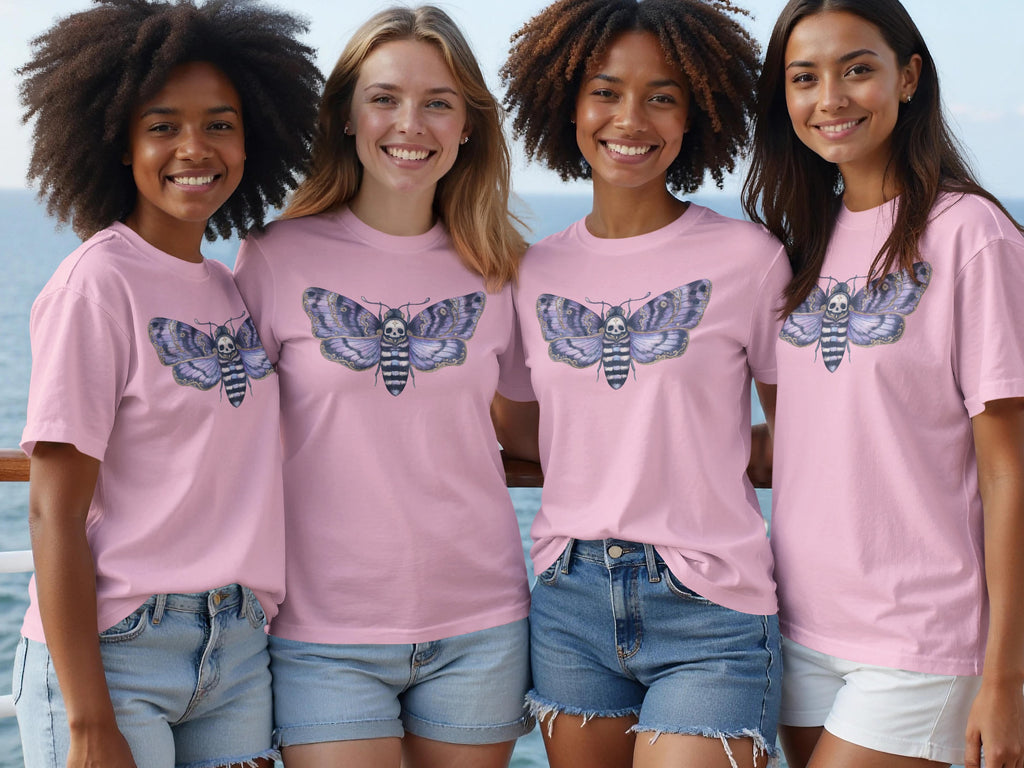Four women wear pink t-shirts featuring a death's-head hawkmoth graphic.