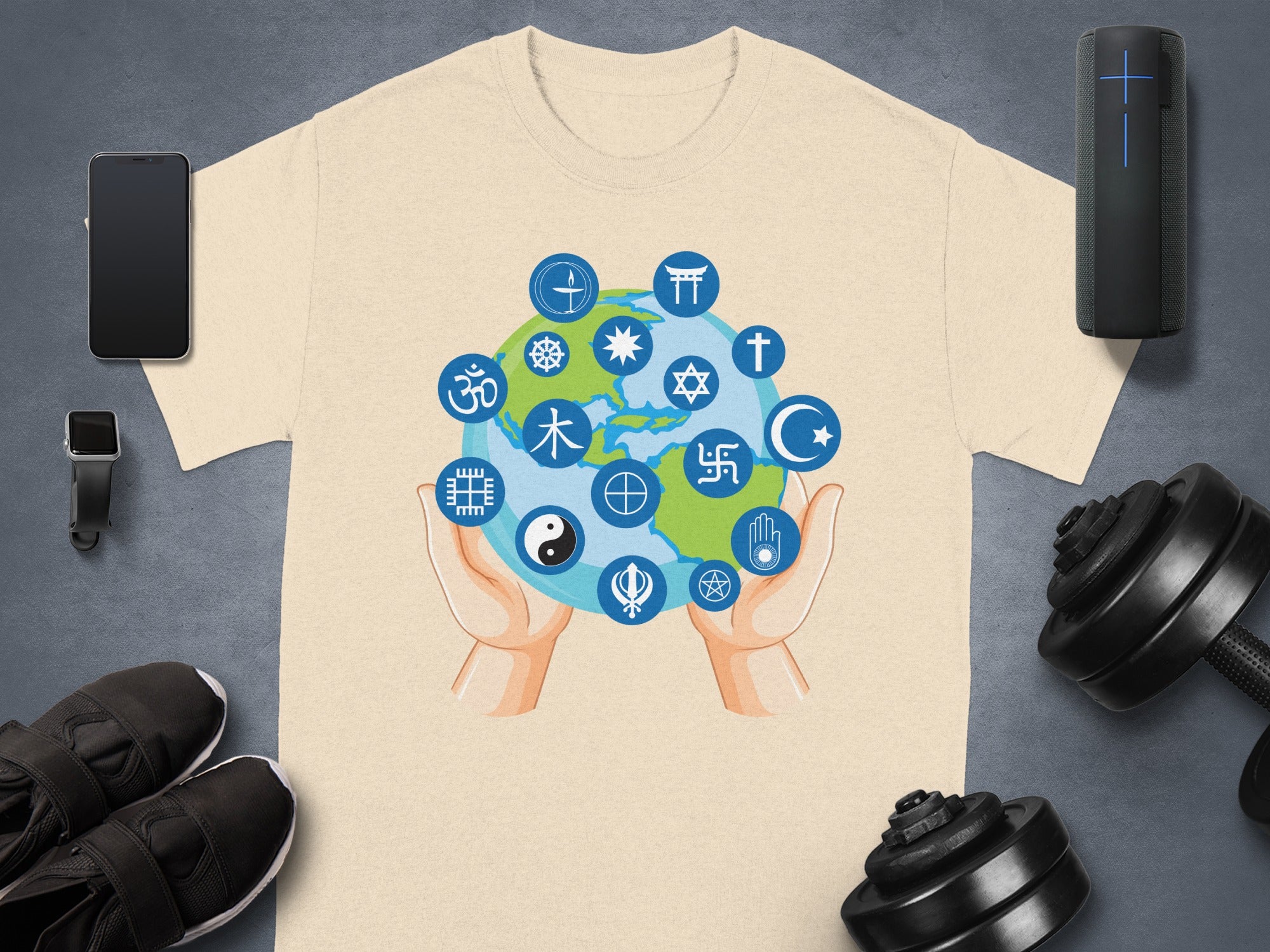 T-shirt with globe surrounded by religious symbols held by hands.