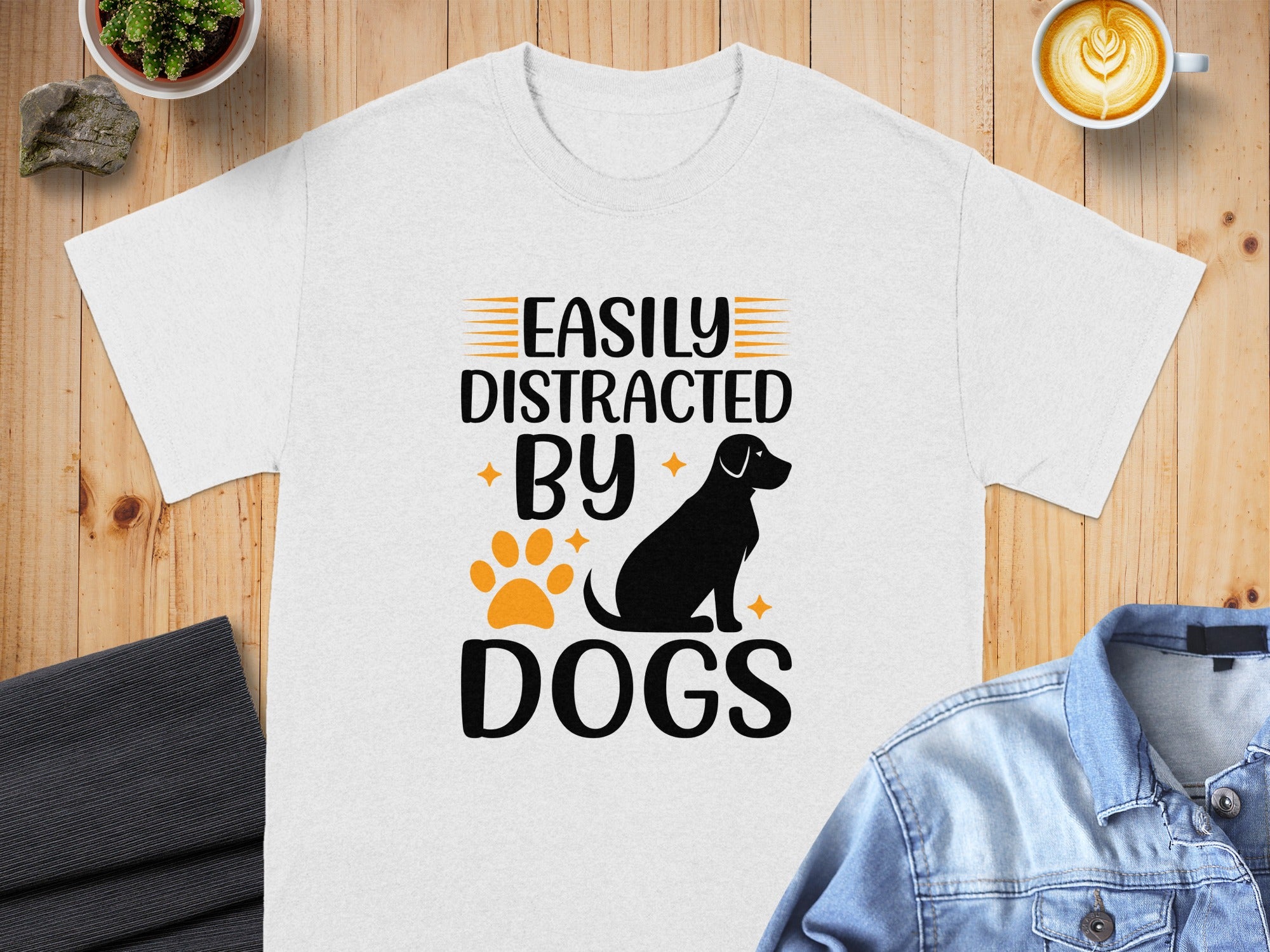 White t-shirt with text "Easily Distracted By Dogs," a dog silhouette, and paw print.
