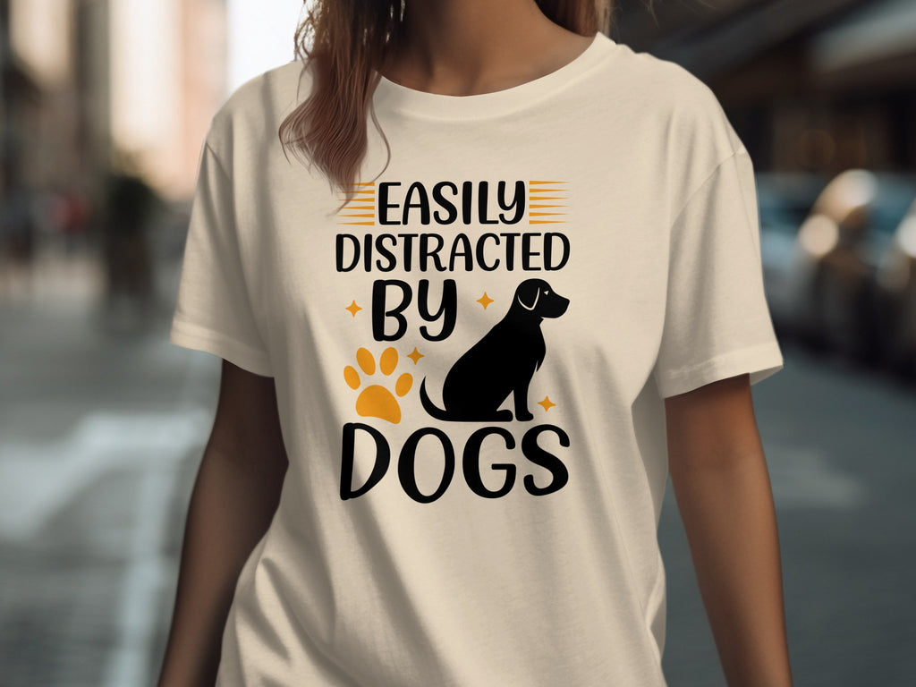 T-shirt with text "Easily Distracted By Dogs" and dog silhouette.