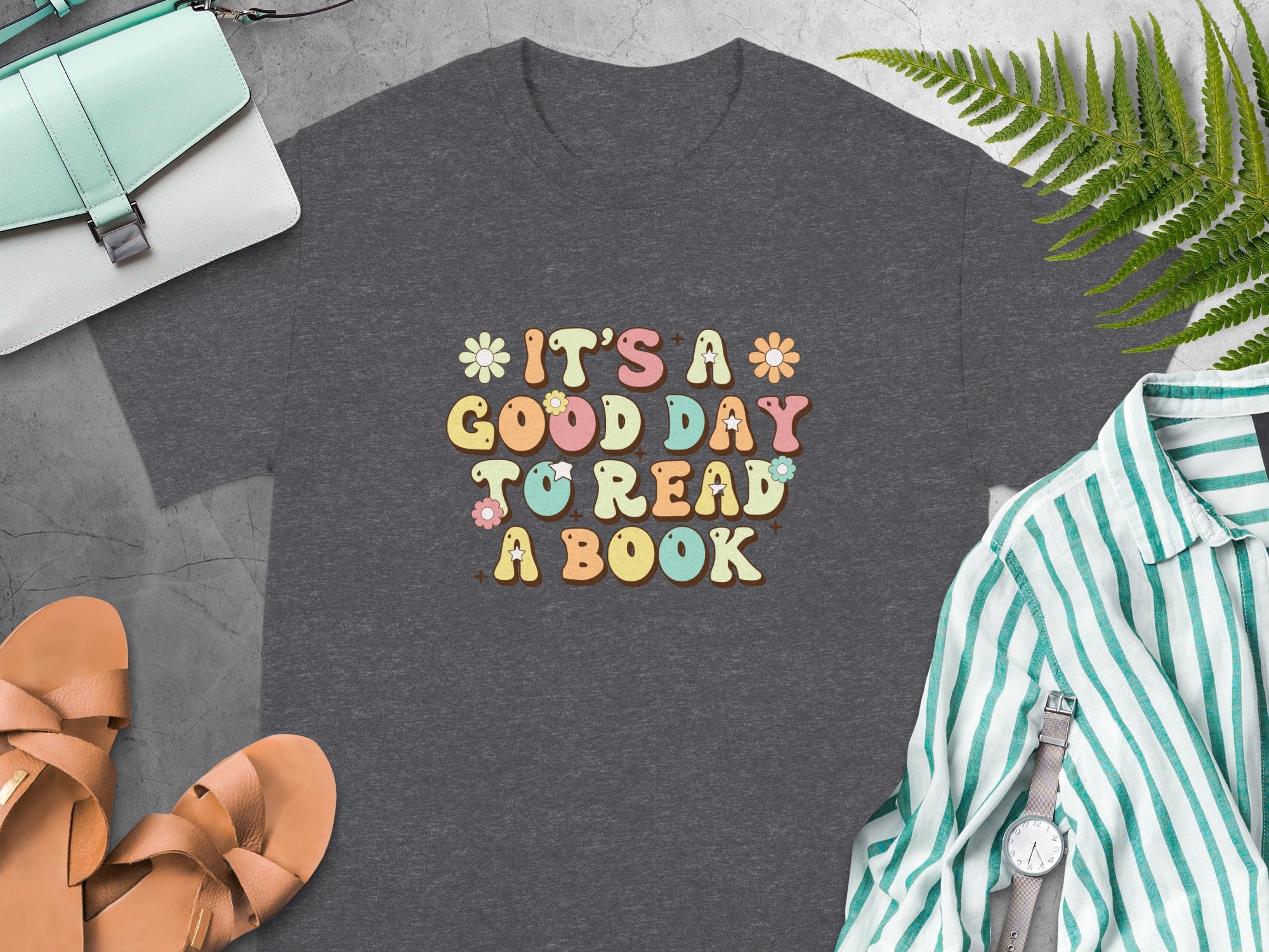Dark grey t-shirt with "It's a good day to read a book" text and flowers.