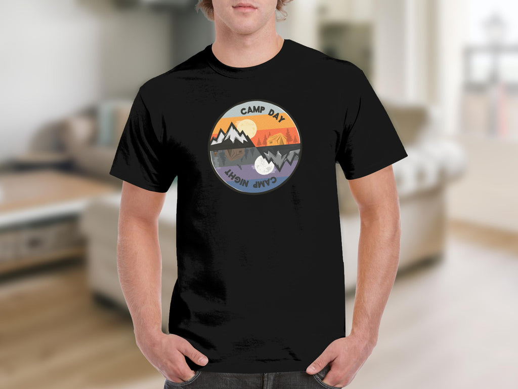 Black t-shirt with circular graphic featuring nature scenes for day and night.