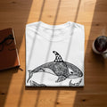 White t-shirt with a black orca whale mandala design.