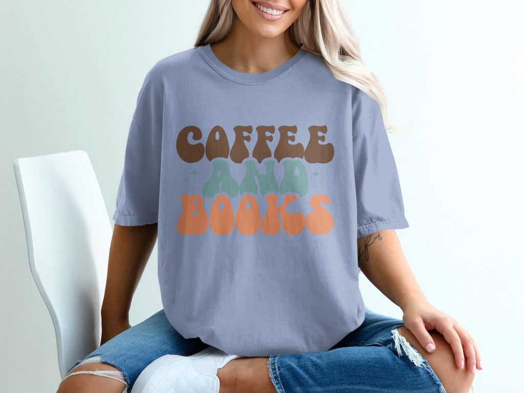 T-shirt with "Coffee and Books" text in retro font and pastel colors.