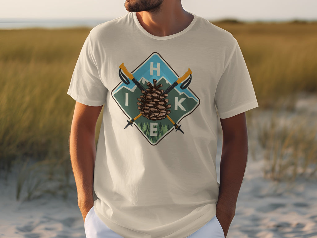 T-shirt with diamond graphic featuring pinecone, hiking poles, and the word "HIKE".