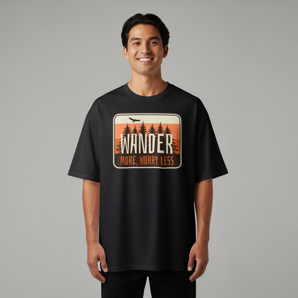 Black t-shirt with "WANDER MORE, WORRY LESS" text and forest graphic.
