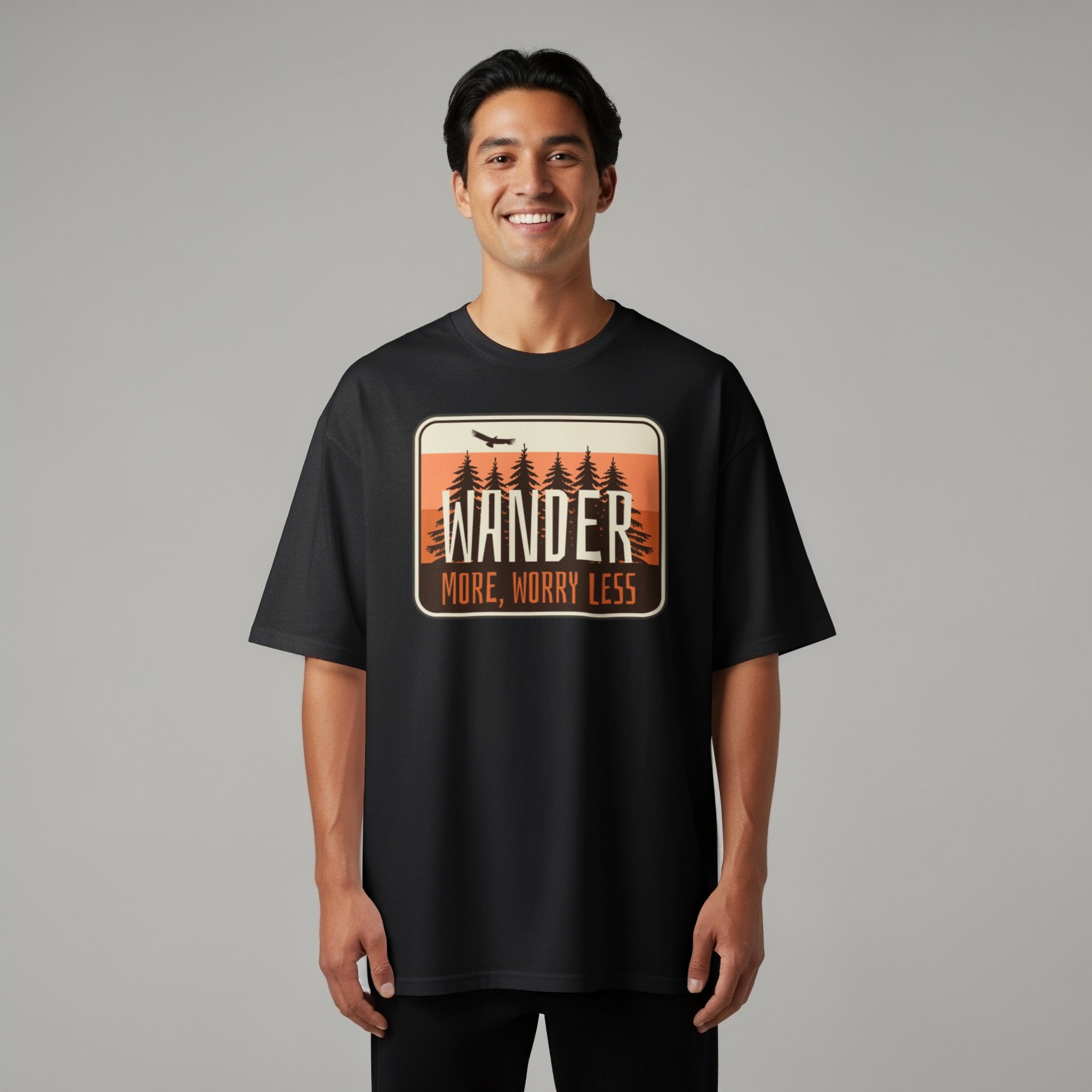 Black t-shirt with "WANDER MORE, WORRY LESS" text and forest graphic.