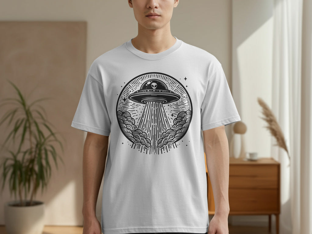 T-shirt with a circular black and white alien spaceship and beam design.