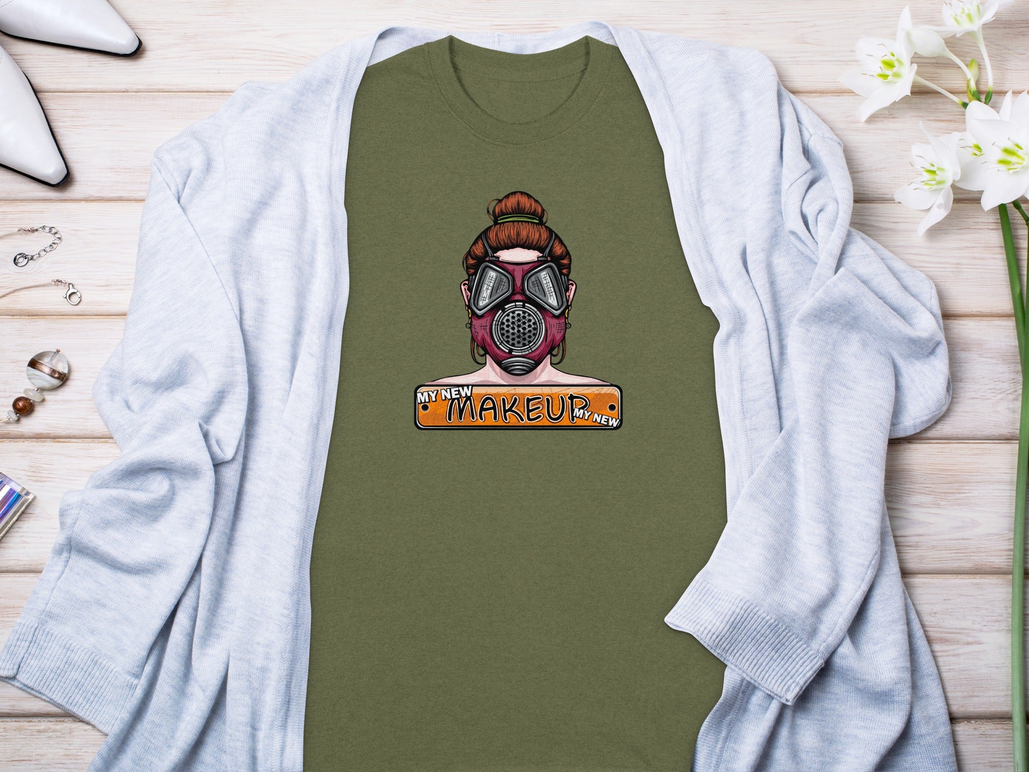 Olive green t-shirt with a graphic of a woman in a gas mask and "My New Makeup" text.