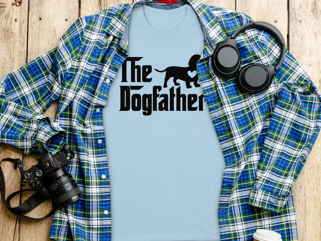 Light blue t-shirt with black "The Dogfather" text and dog silhouette.