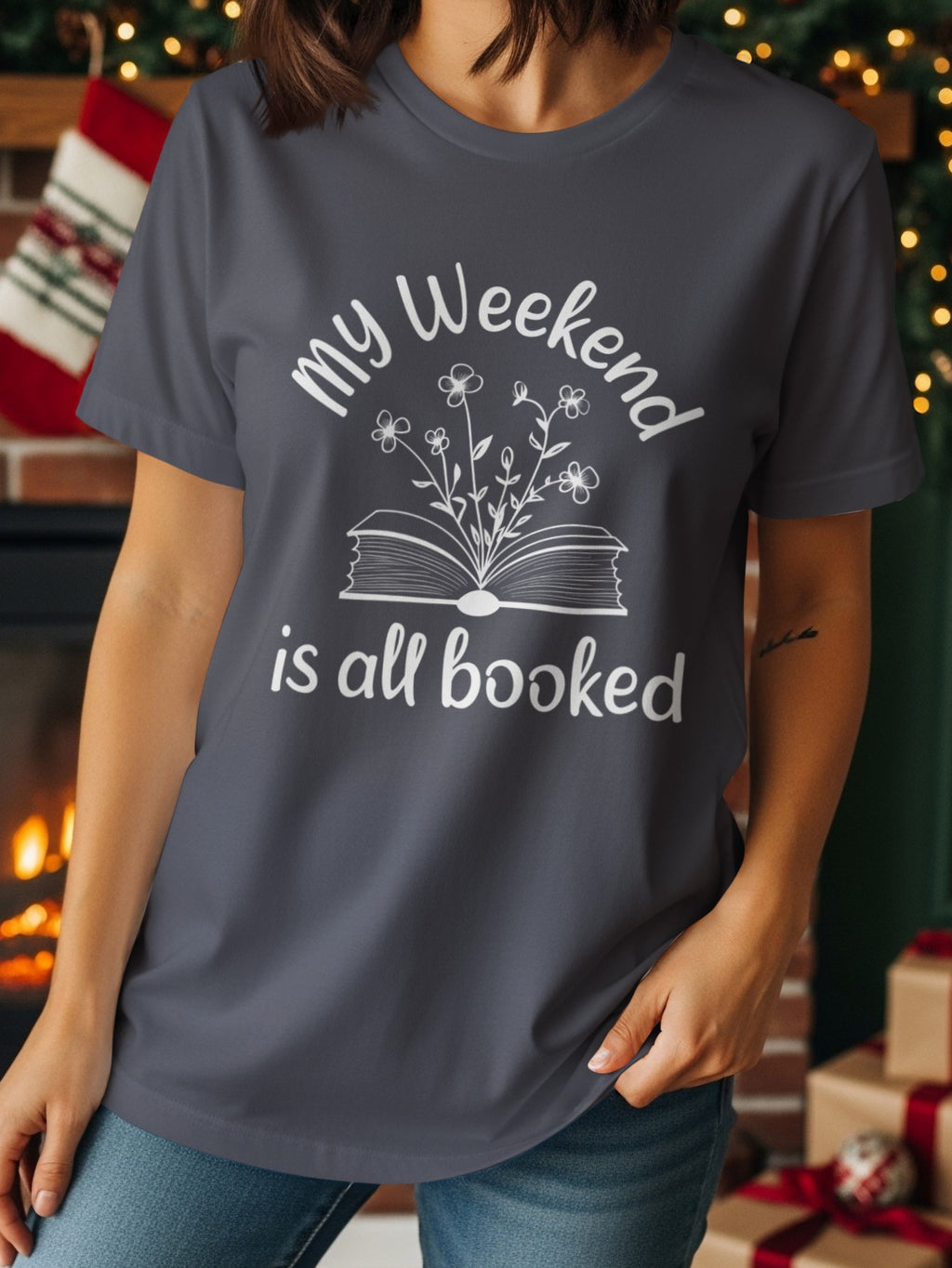 "My Weekend is All Booked" text and open book with flowers graphic on a t-shirt.