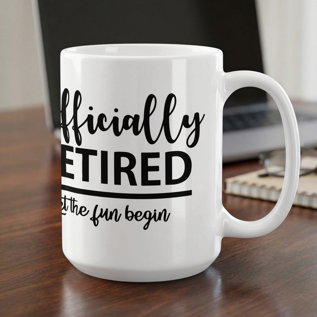 White mug with black text: "Officially RETIRED Let the fun begin".