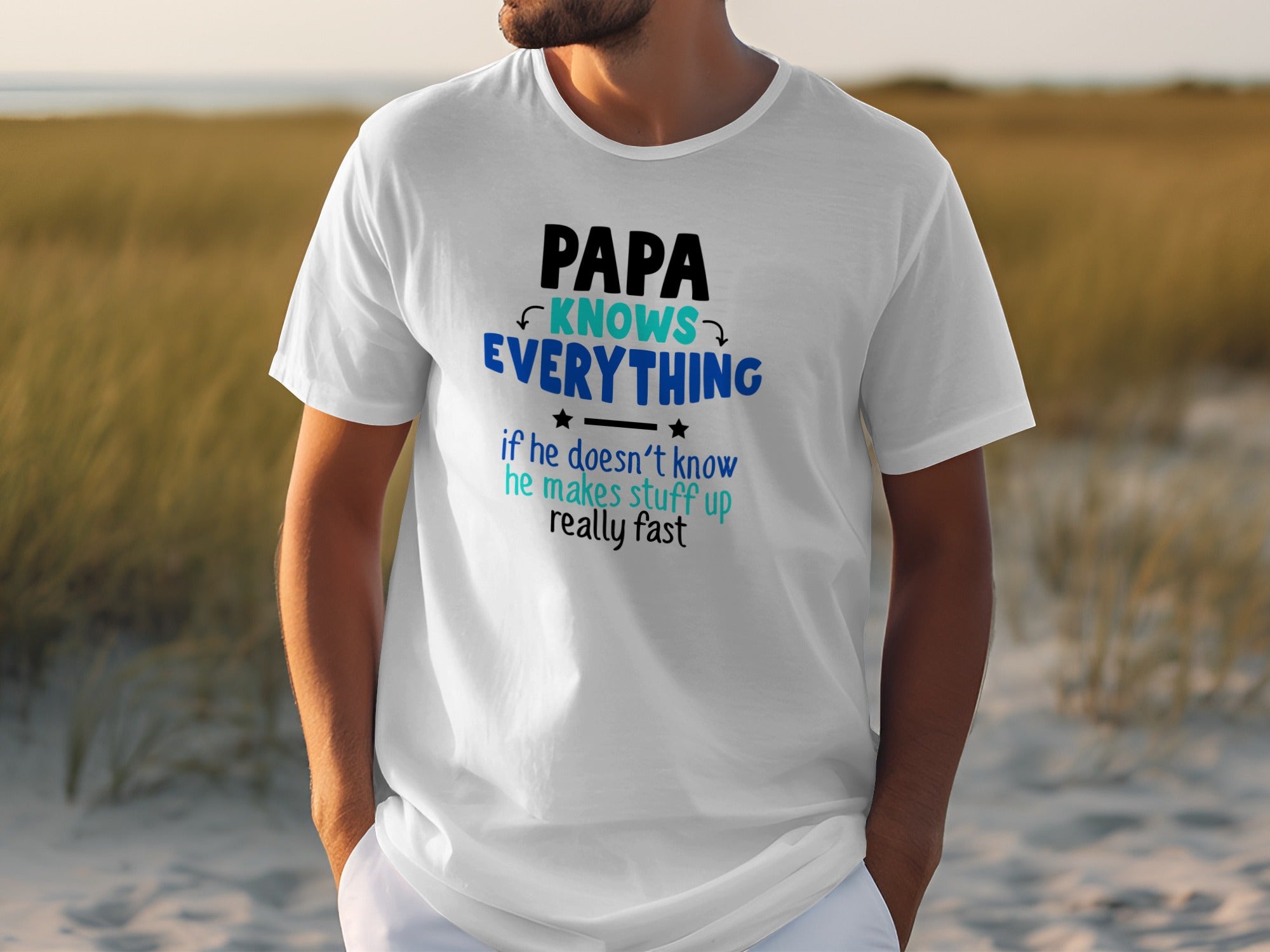 White t-shirt with "PAPA KNOWS EVERYTHING if he doesn't know he makes stuff up really fast" text.