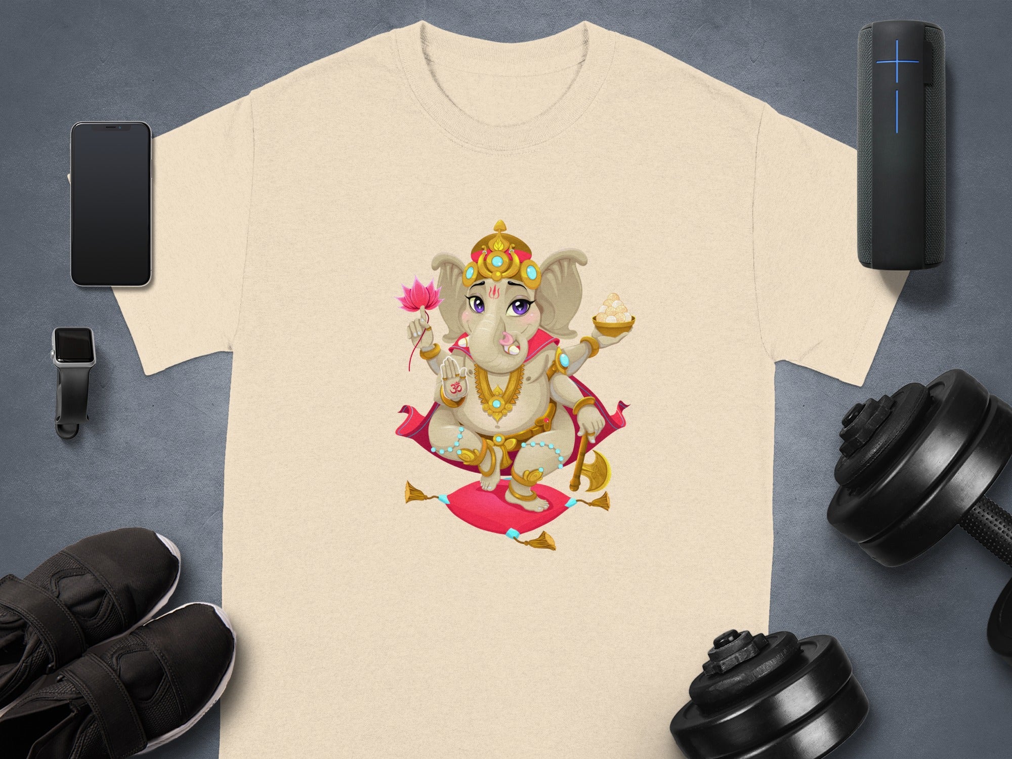 T-shirt with Ganesha illustration holding lotus and sweets.