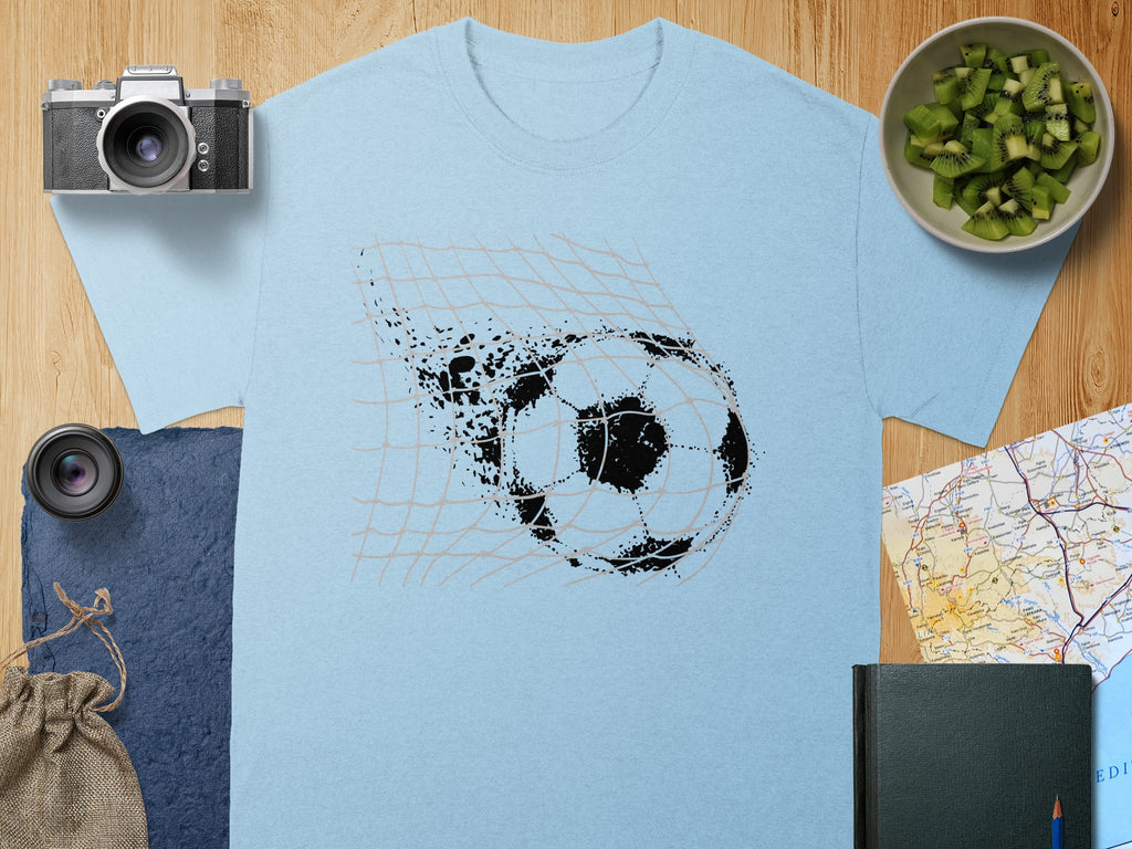 Light blue t-shirt with a black football breaking through a net graphic.