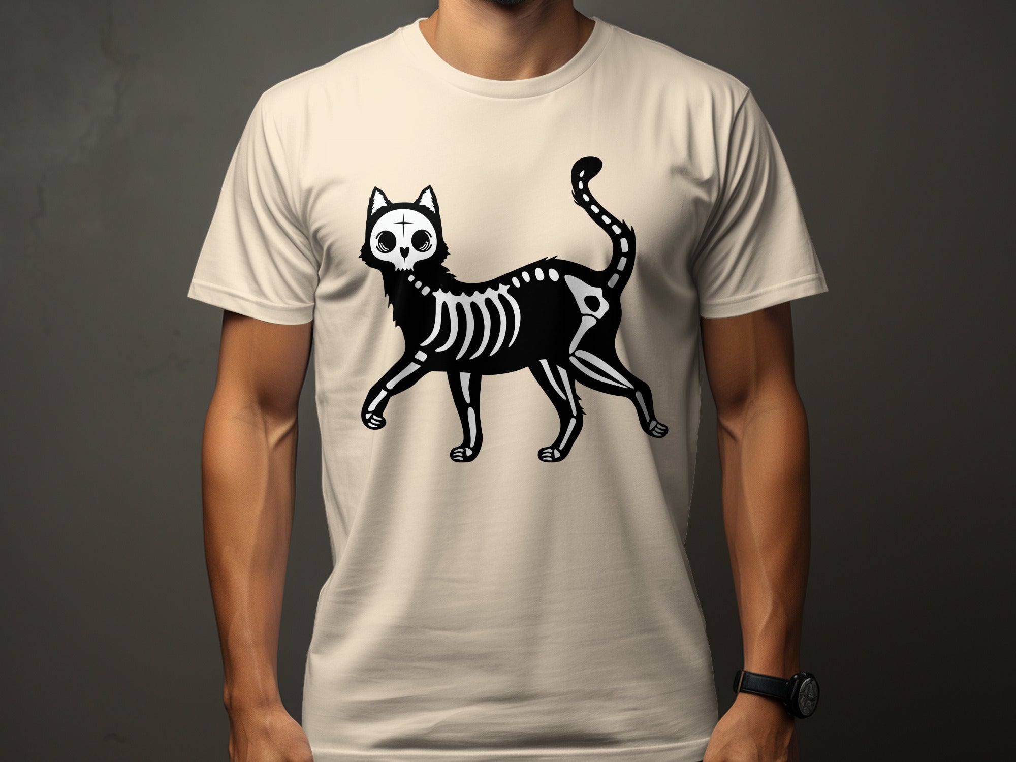 Black skeleton cat graphic with cross on forehead on a tan t-shirt.