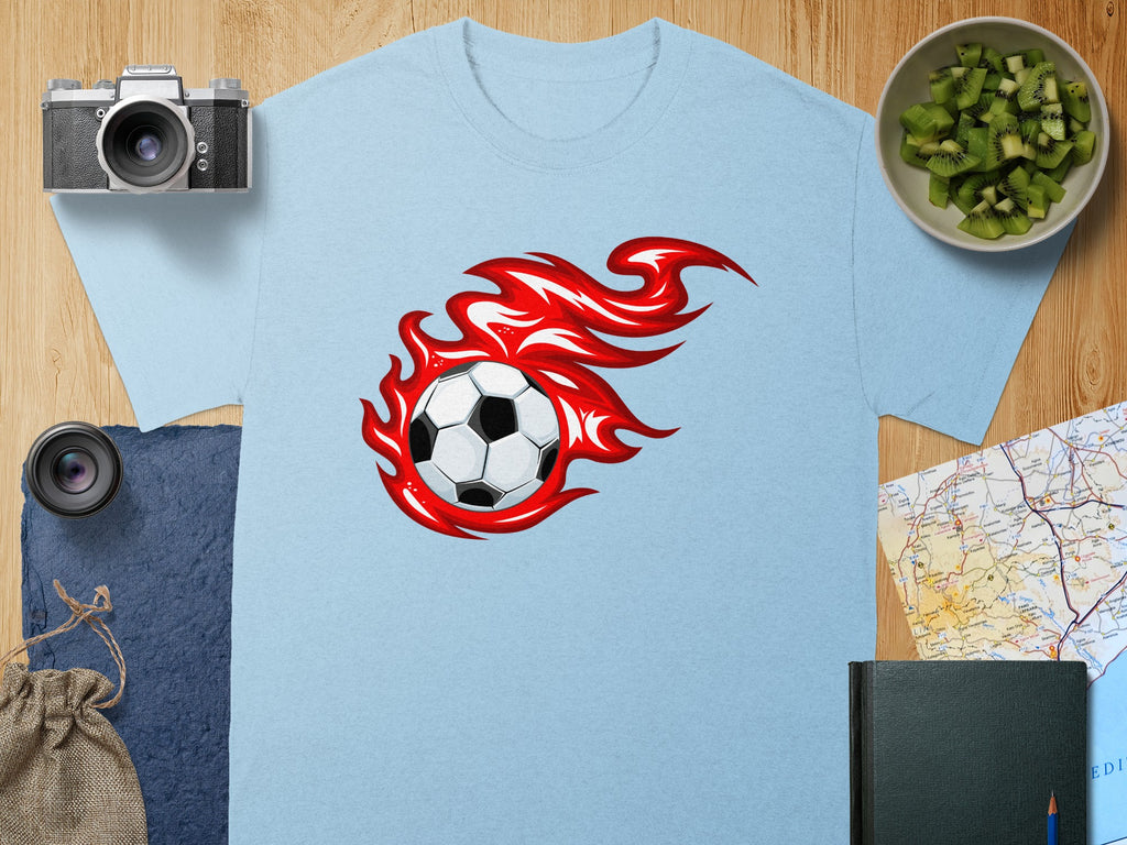 Light blue t-shirt with a soccer ball on fire graphic.