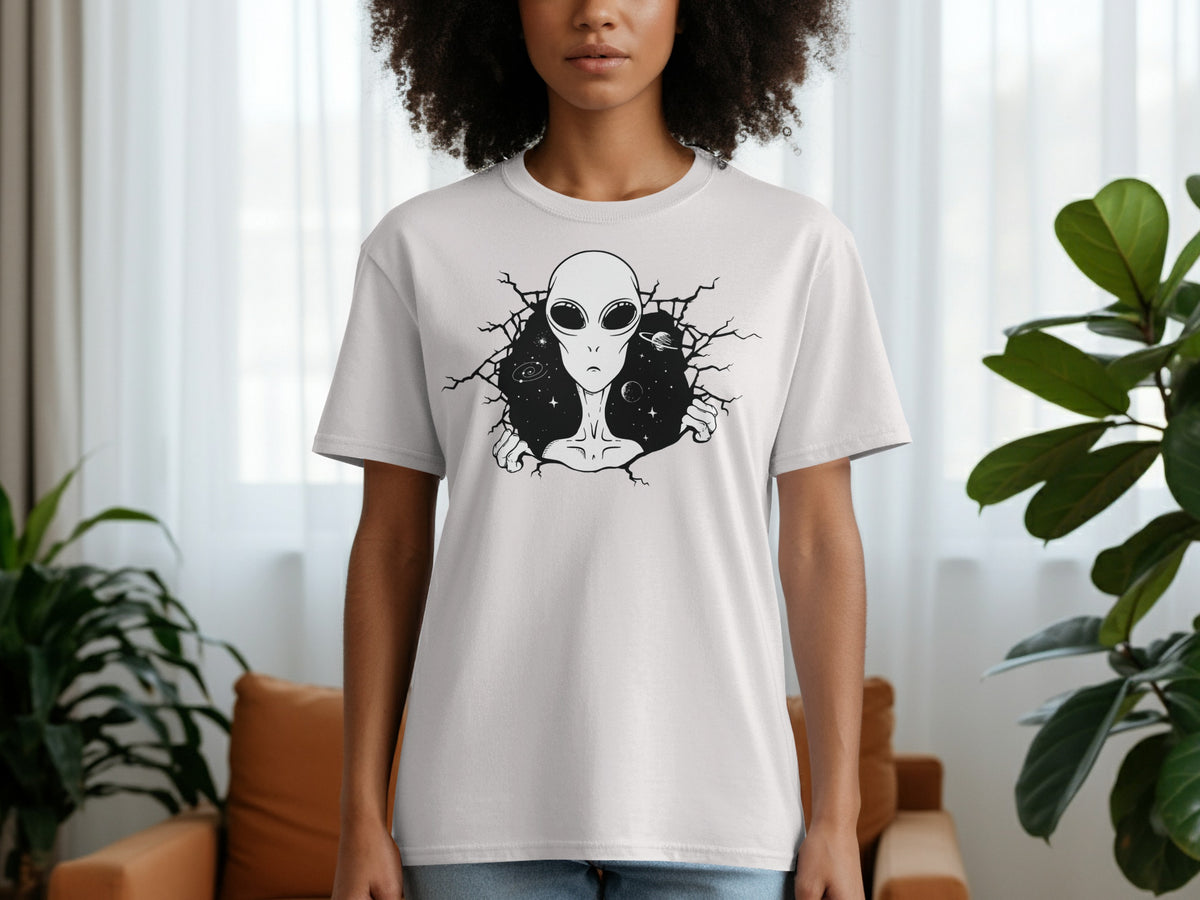 White t-shirt with a black alien and galaxy graphic design.