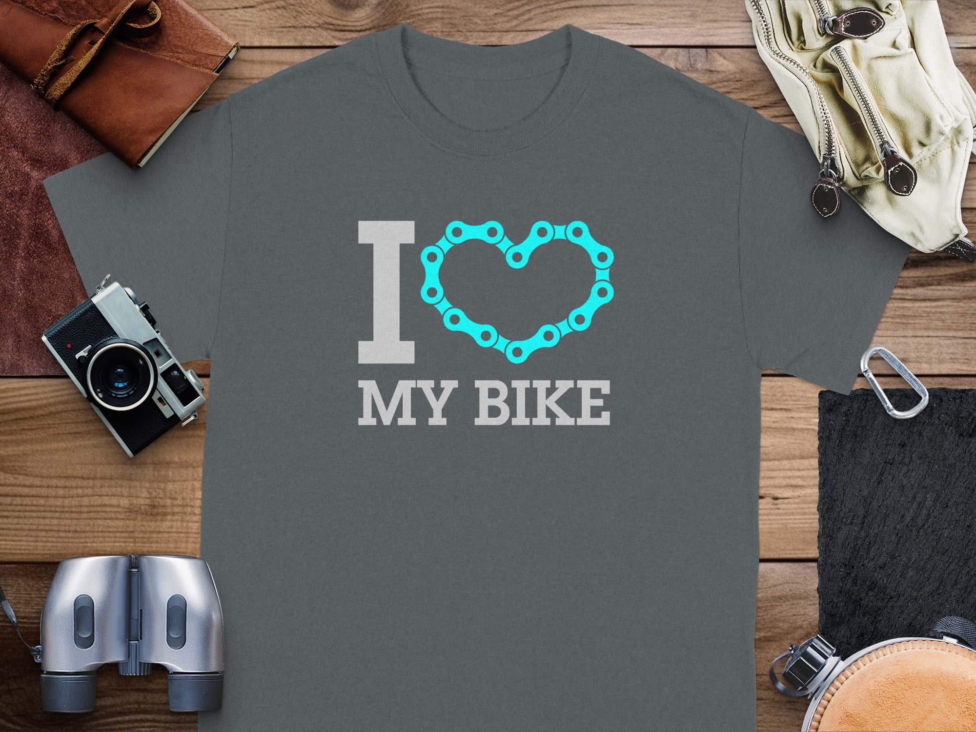 "I love my bike" text on a grey t-shirt with a bicycle chain heart.