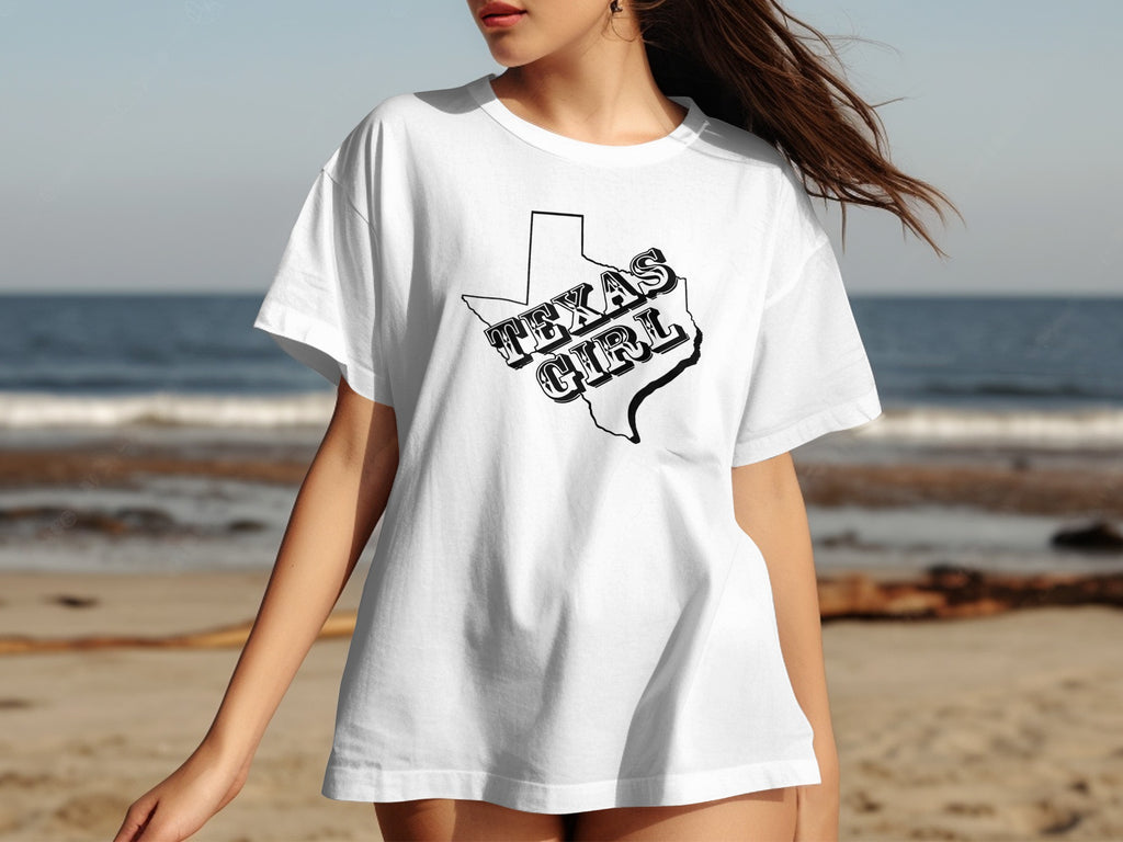 White t-shirt with black outline of Texas filled with "TEXAS GIRL" text.