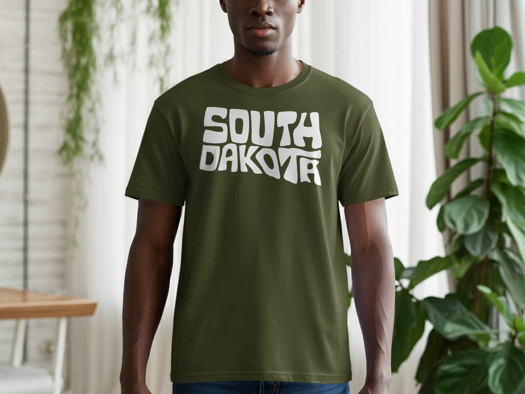 Olive green t-shirt with white "SOUTH DAKOTA" text in wavy font.