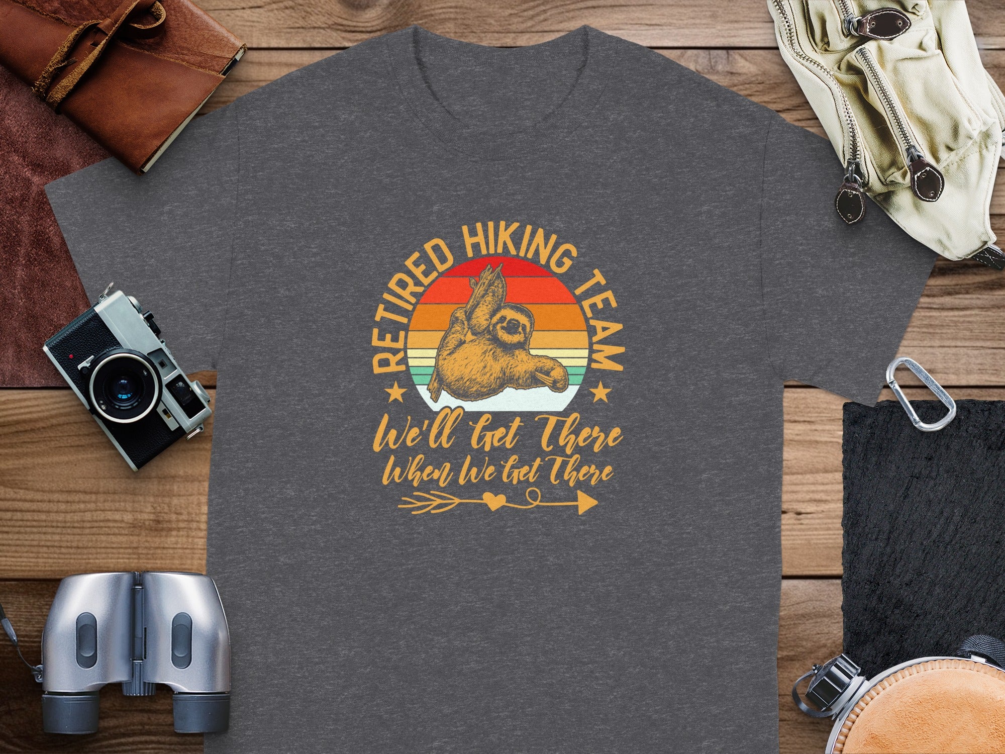 Dark t-shirt with vintage sloth graphic reading "Retired Hiking Team".