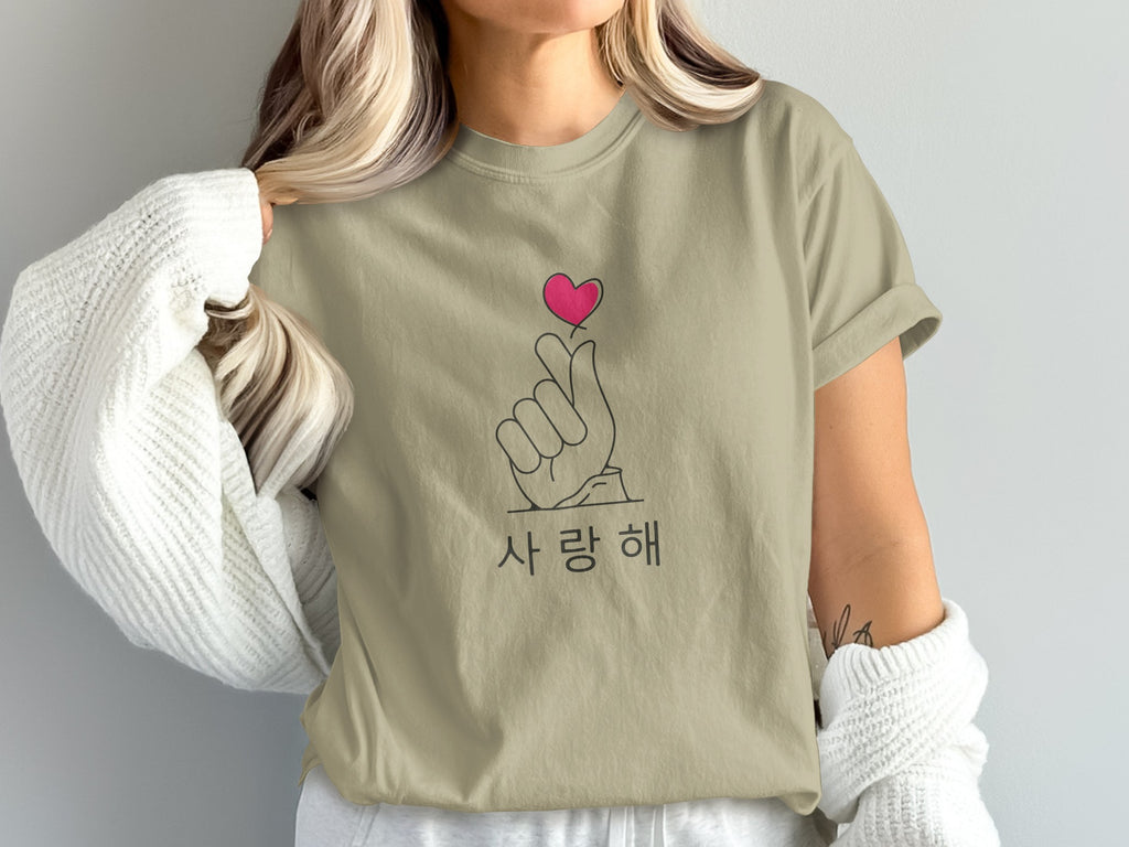 T-shirt with Korean text "사랑해" and finger heart gesture.