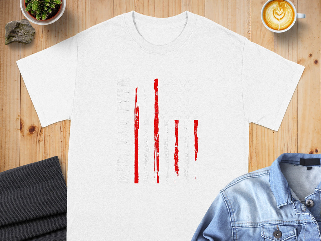 White t-shirt with a distressed American flag graphic and text.