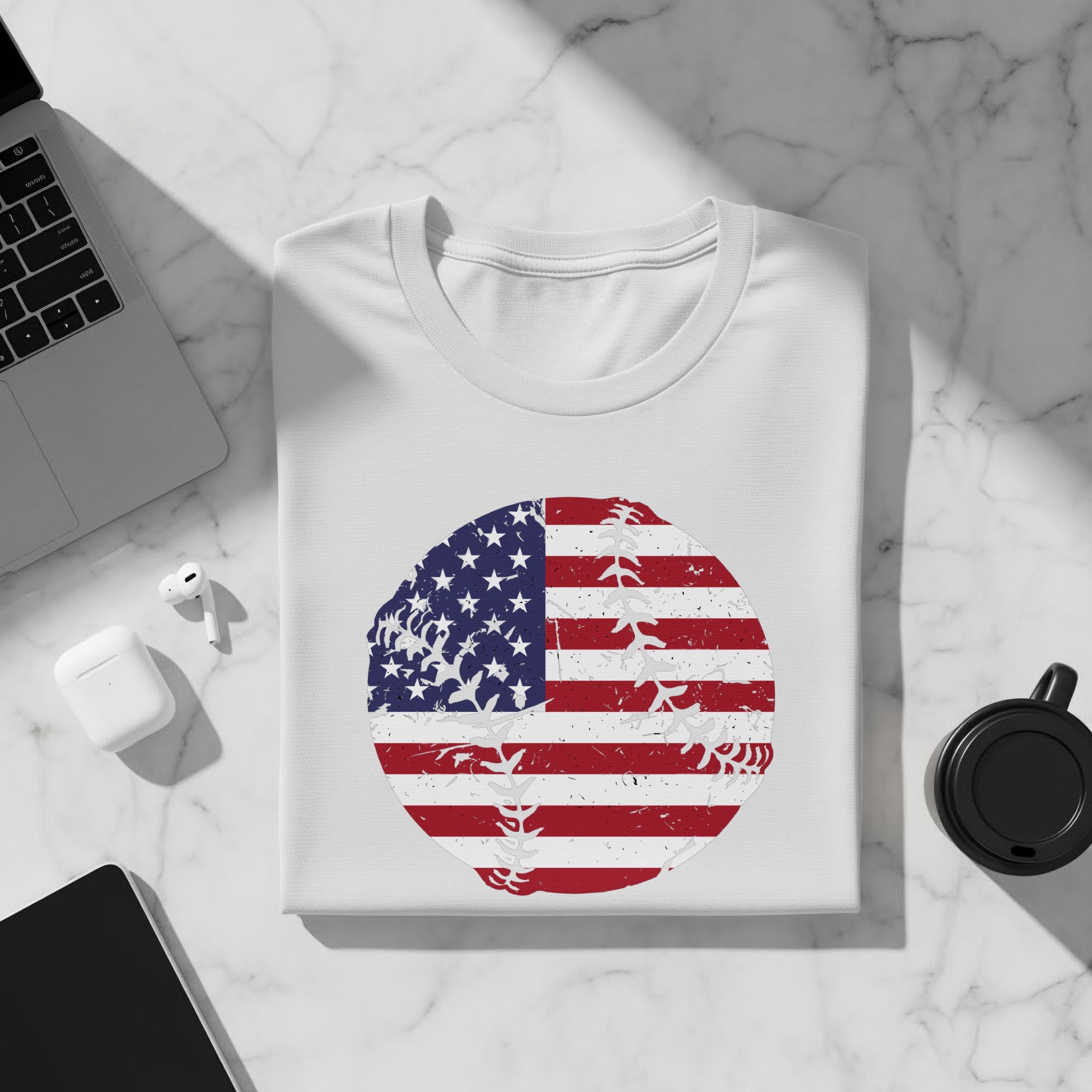 White t-shirt with distressed American flag baseball graphic.