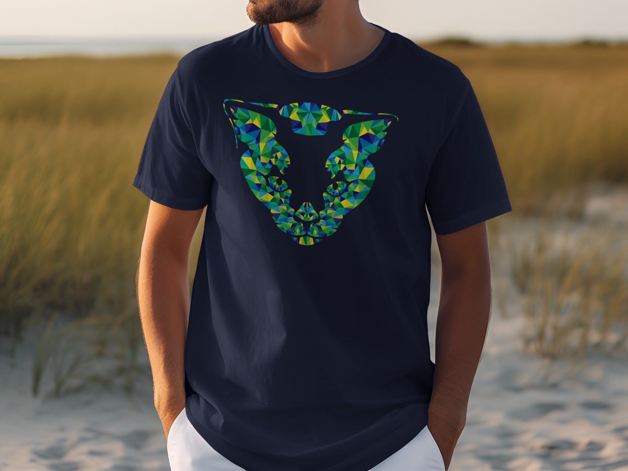 Navy t-shirt with geometric green and blue abstract cat face design.