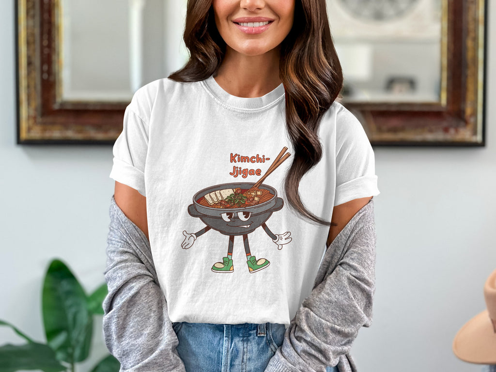 White t-shirt with cartoon Kimchi Jjigae bowl with legs, arms, and happy face.