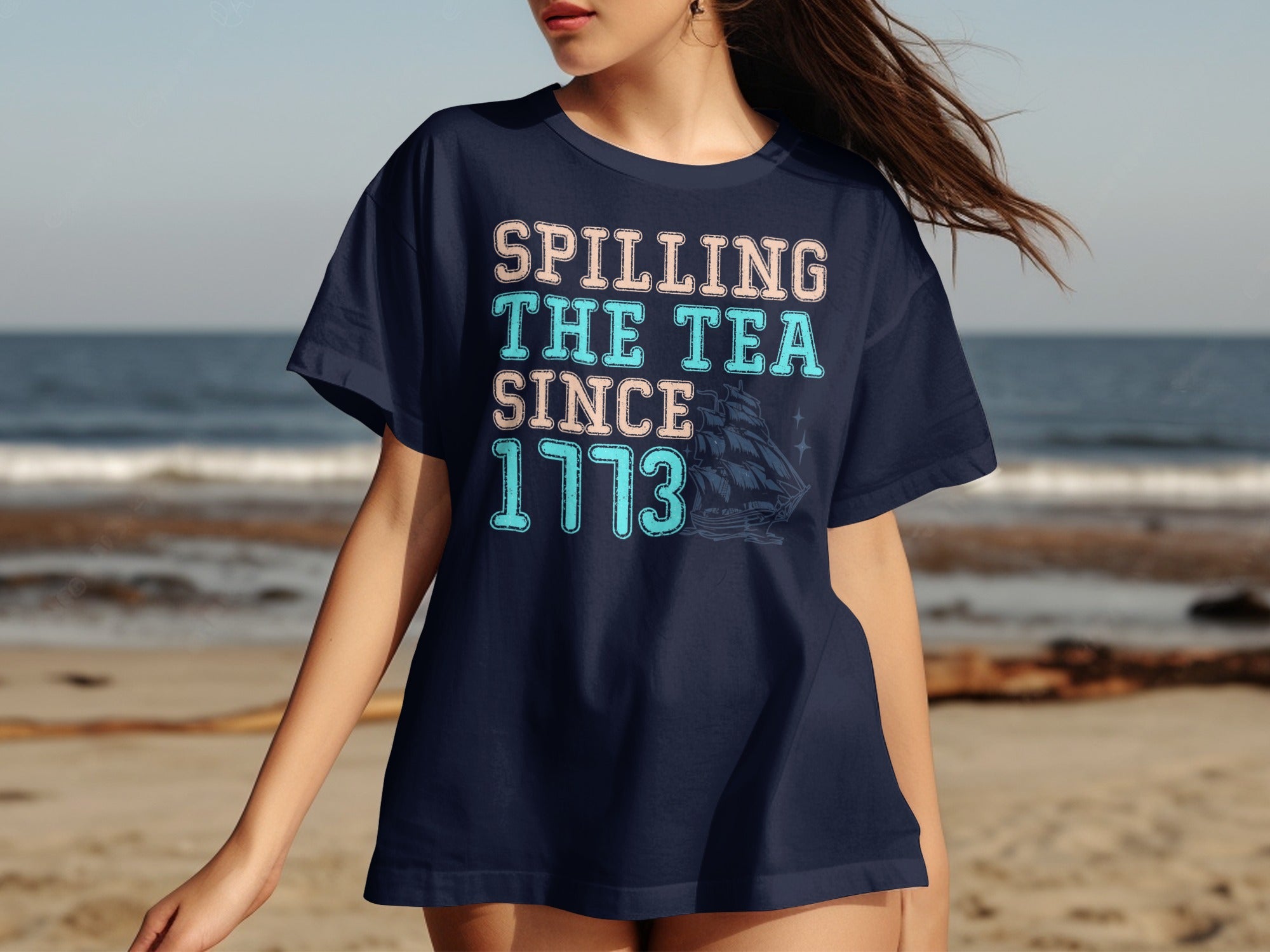 Navy t-shirt with text "Spilling The Tea Since 1773" and a ship graphic.