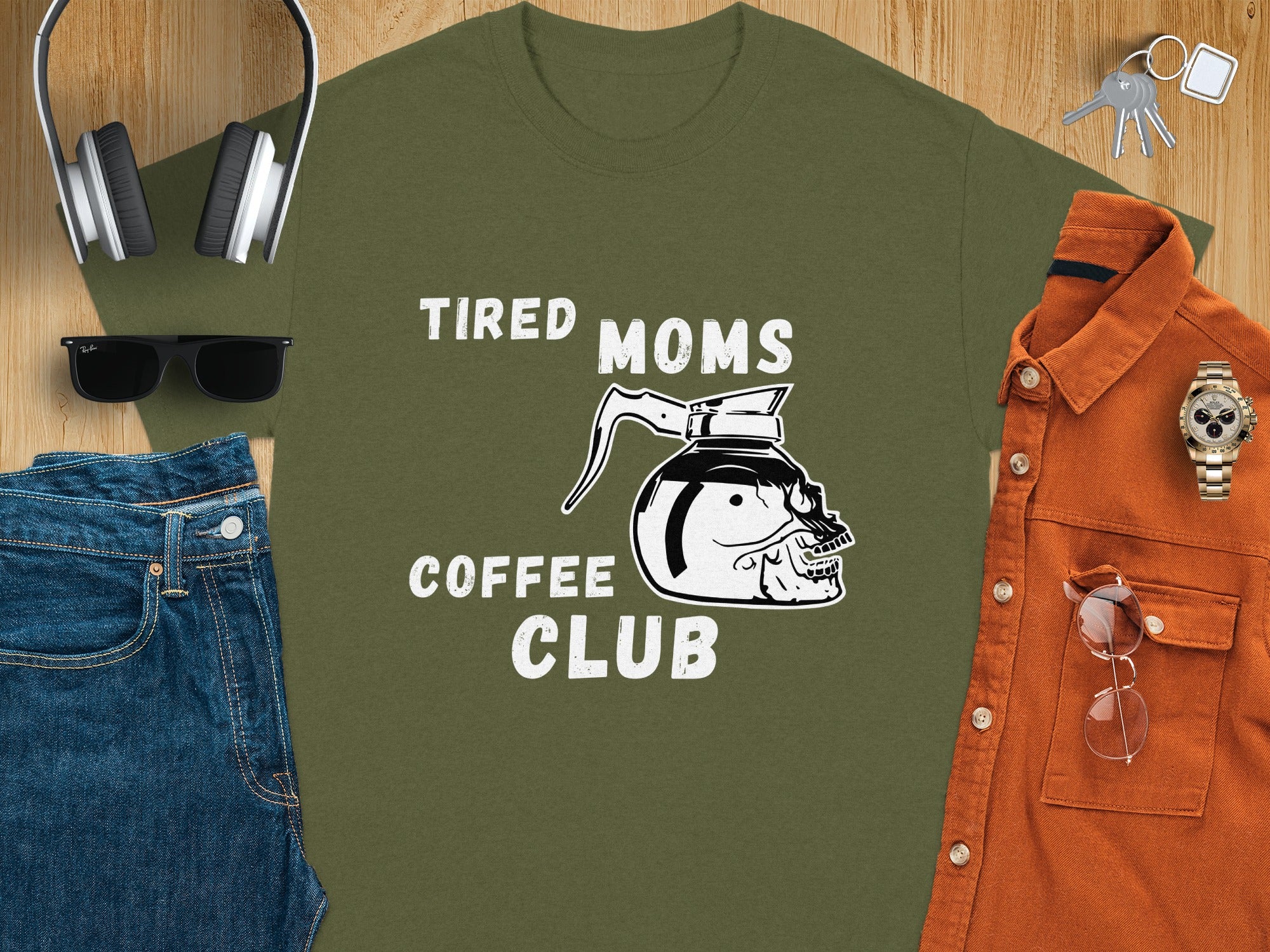 Olive green t-shirt with skull coffee pot graphic and "Tired Moms Coffee Club" text.