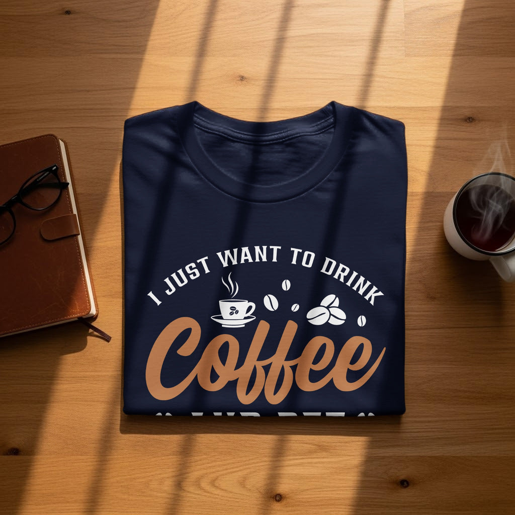Navy t-shirt with "I JUST WANT TO DRINK COFFEE" text and coffee graphics.