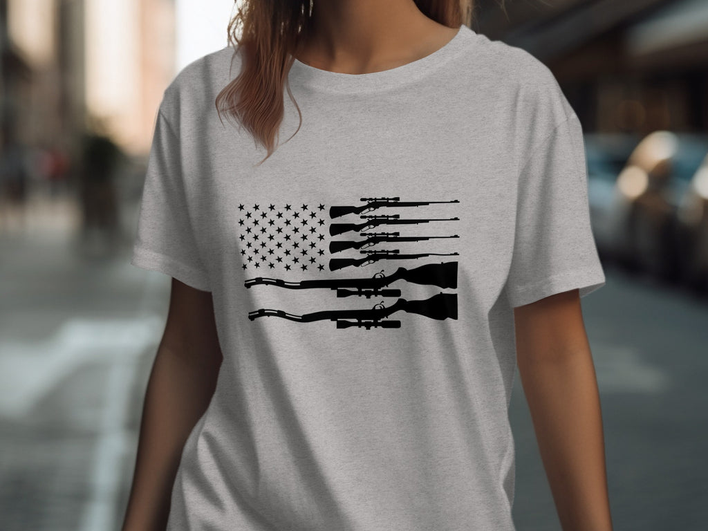 Gray t-shirt with an American flag design made of rifle silhouettes.