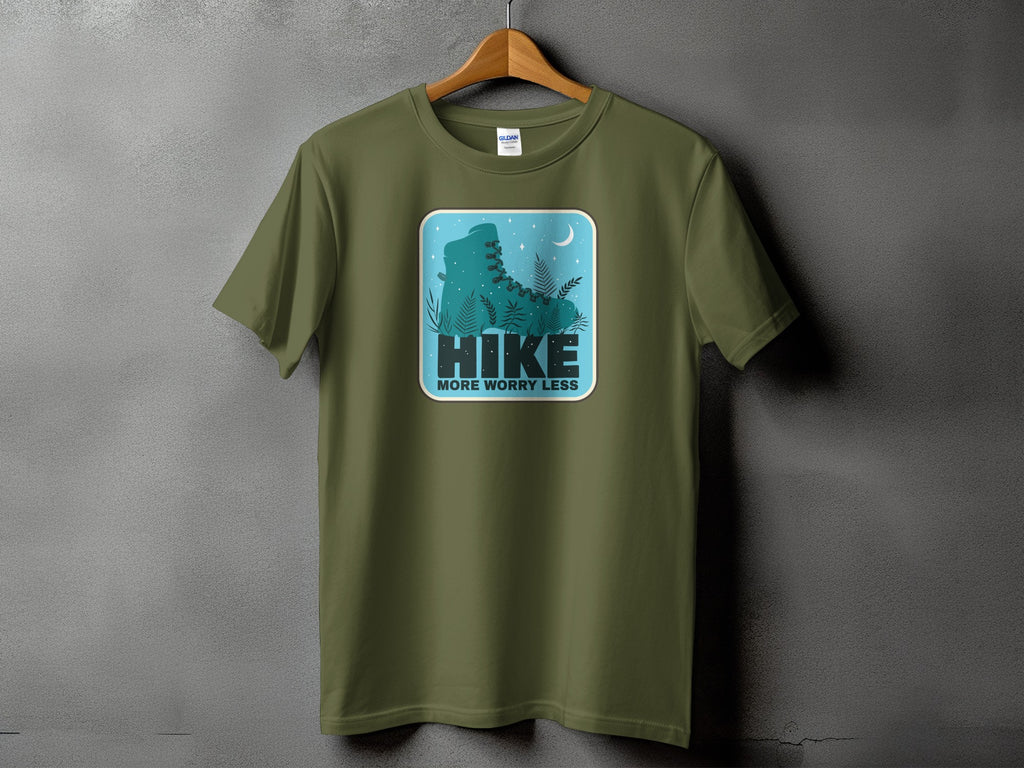 Olive t-shirt with a graphic of a hiking boot and text "Hike More Worry Less."